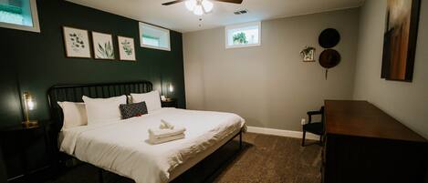 Master bedroom - King size bed, seating area, dresser and closet.