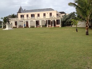 Lawn area outside of room from ocean edge sitting. Loads of places to play. Priv