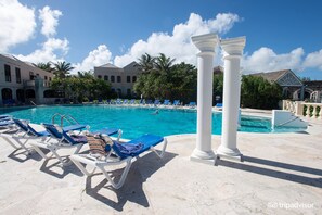 The pool outside the south deck, covered with table and chairs