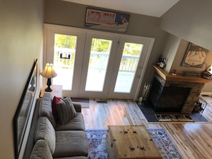 Living area, deck, wood burning fireplace