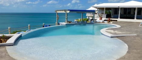 Welcome to Neptune Cove.  Swim in our clifftop infinity edge pool with swim up bar.