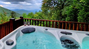 6 person hot tub in a private setting with incredible layered mountain views