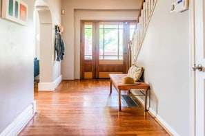 Bright, elegant wooden floors extend across the first floor.