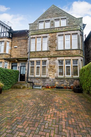 Front of house with two off-street parking bays