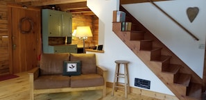 Living room looking towards the frond door and kitchen