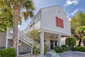 Entrance to home with COMPACT CAR parking spot