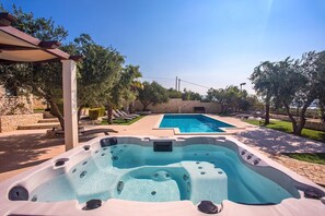 Jacuzzi for 5 people is next to the pool