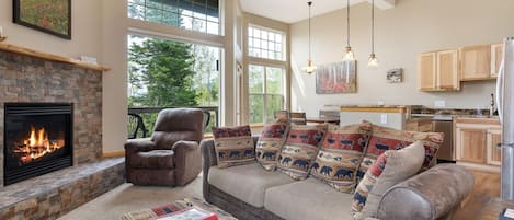 Natural Light Coming Through The Large Windows looking Onto Views!