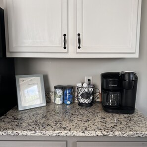 Coffee bar with complimentary K Cups and cream and Sugar