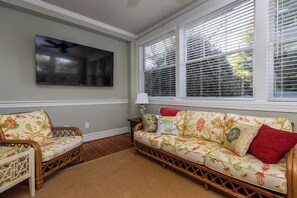 Big screen TV in sunroom