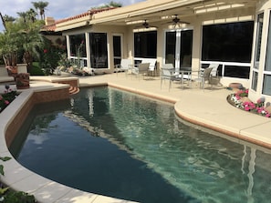 View of pool deck from across pool