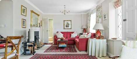 The sitting room is furnished in the style of an Irish Georgian country house. 