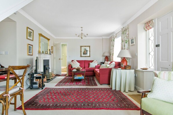 The sitting room is furnished in the style of an Irish Georgian country house. 