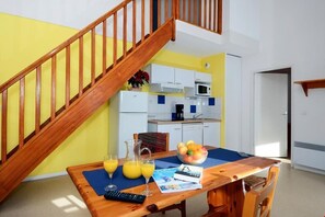 Prepare meals in the kitchenette and enjoy them around the dining table