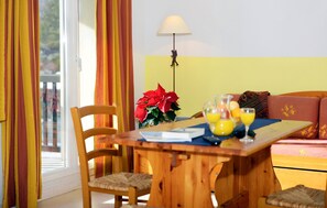 The brightly decorated living room creates a lively atmosphere