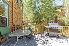 Private deck featuring seating and a grill.