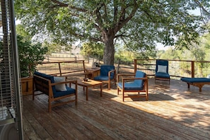 Enjoy this fabulous deck and furniture to appreciate the views or enjoy your morning cup of coffee. (If unit one is occupied the back porch and deck are not available).