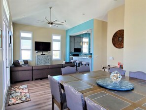 Open living room, kitchen and dining area for your family. 