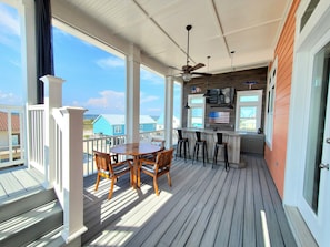 Custom built bar with big screen TV. Perfect for hanging out and watching sports