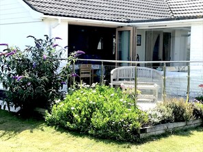 Sun terrace with tri-fold doors when open extend living space
