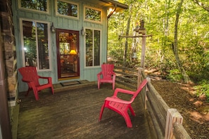 Relax on the side porch and listen to the creek as it flows past.