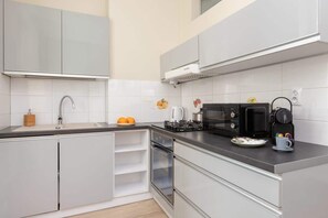 The kitchen is fully equipped with high-quality appliances for all your culinary needs.