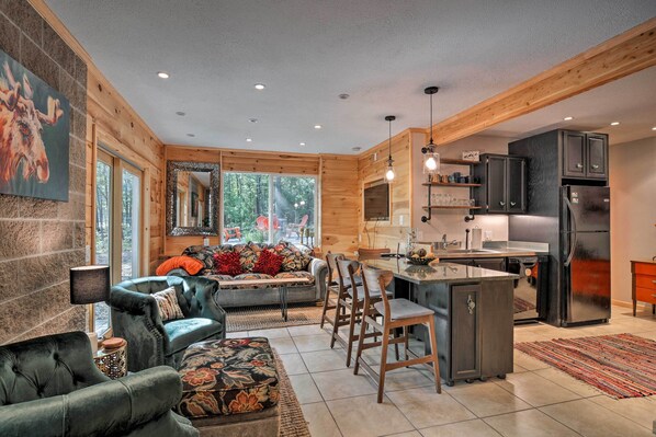 Experience all that Interlochen has to offer from this charming cabin.