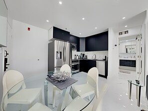 Dining & Kitchen with state-of-art induction cooktop, built-in oven, convection oven, dishwasher, French style refrigerator.