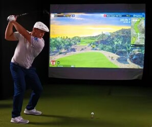 Home has a combined Golf Studio, Game & Movie room with some comfortable movie bean bag chairs to watch your favorite movie or game.