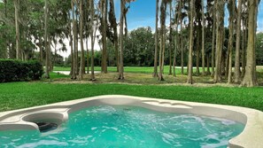 Back garden with hot tub jacuzzi overlooking lake and Saddlebrook Golf Resort Course.