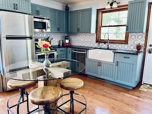 Newly remodeled full-sized kitchen stocked with the cooking/dining essentials.