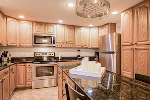 Grand kitchen equipped w/ cooking & dining essentials