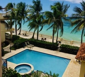 Our place overlooks the beautiful ocean, beach, resort grounds, pool and hot tub