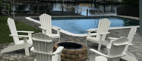 Fire pit with 6 chairs overlooking Banana River