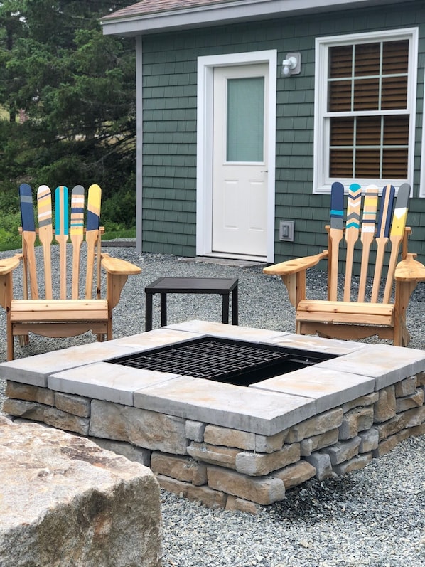 fire pit and Adirondack chairs