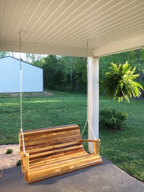 Gorgeous front porch swing to relax and unwind.