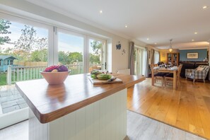 Kittiwake Cottage, Brancaster: Open plan living environment with french doors to outside