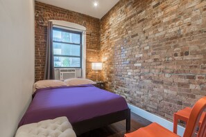 This bedroom has a full bed, sleeps 2, with sliding door for privacy. 