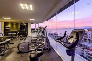 Rooftop gym with views of the bay