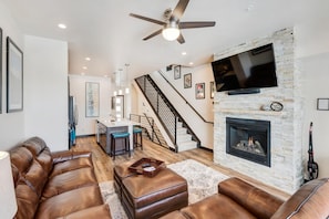 Open Floor Plan with Gas Fireplace and Leather Couches at Winter Park Home for Rent