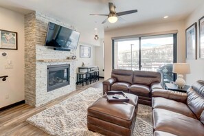 Main Living Area with 55" HD TV, Fireplace, and Leather Couches