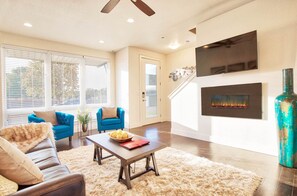 Living room. 50” TV and electric fireplace 