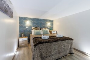 This bedroom has a large bed where you can have a great night of sleep.