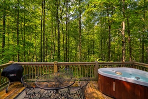 open back deck with forested view