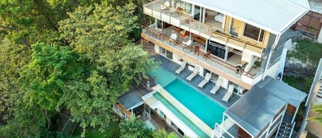 Our 4 Story waterfall House is surrounded by the Jungle! Enjoy nature from our infinity pool!