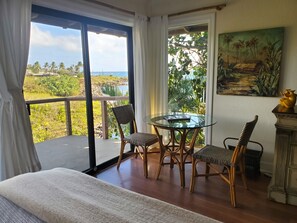 Oceanfront view from King Bed with NEW AC Fine art. Television just out of view.