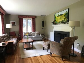 The gracious living room has a working fireplace.