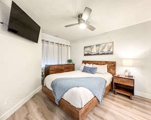 Relax in our queen bed with access to smart TV and window view of Bear Lake