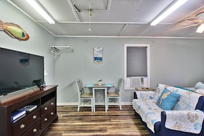 loveseat and 50 inch tv. Youtube TV subscription included. Dining table for 2!