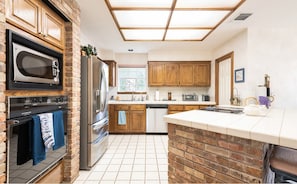 Making a delicious home cooked meal is made easy with this fully equipped kitchen.